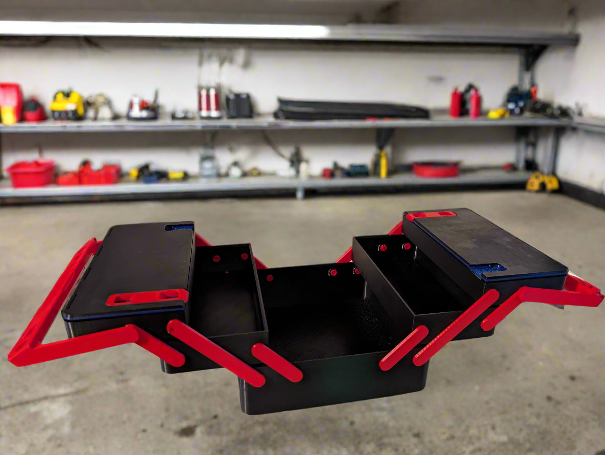 Black and red desk organizer with multiple compartments on a desk.