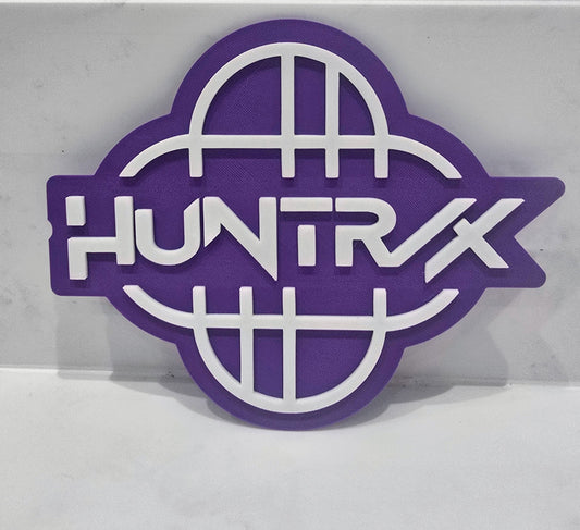 Purple and white logo with 'HUNTRX' text on a gray background