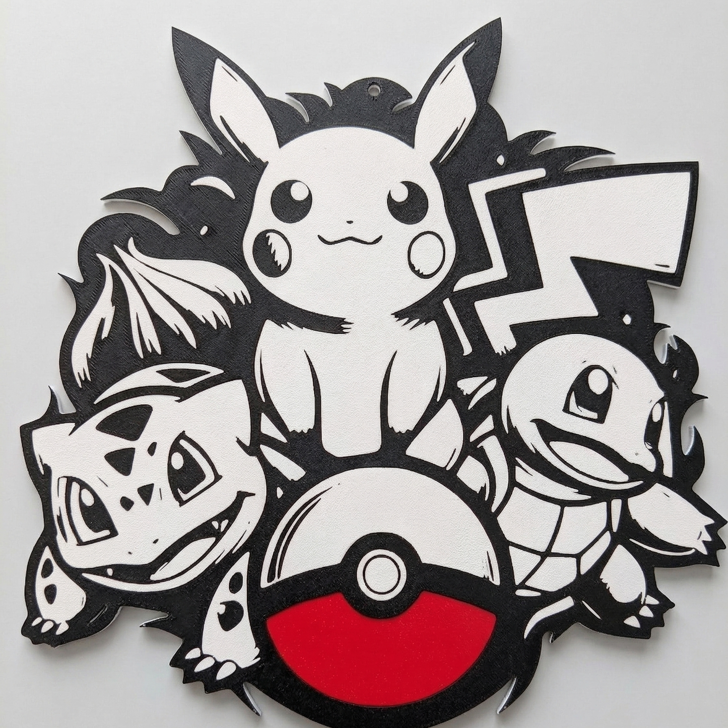Pokémon-themed decorative wall art with Pikachu, Bulbasaur, Charmander, and a Poké Ball on a white background.