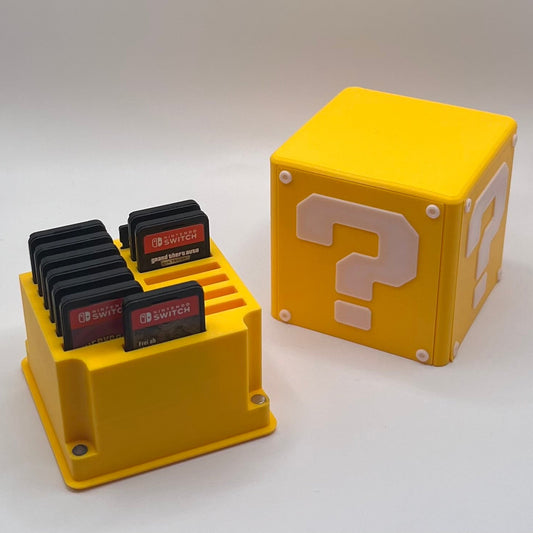Yellow cartridge holder with GameCube cartridges and a question block on a white background