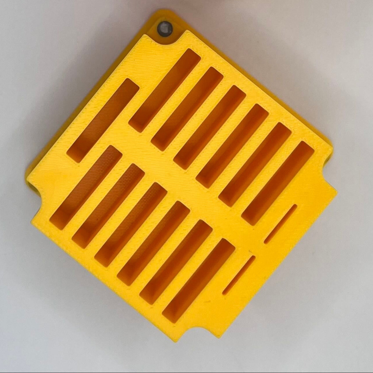 Yellow question block and power-up from a video game on a gray background