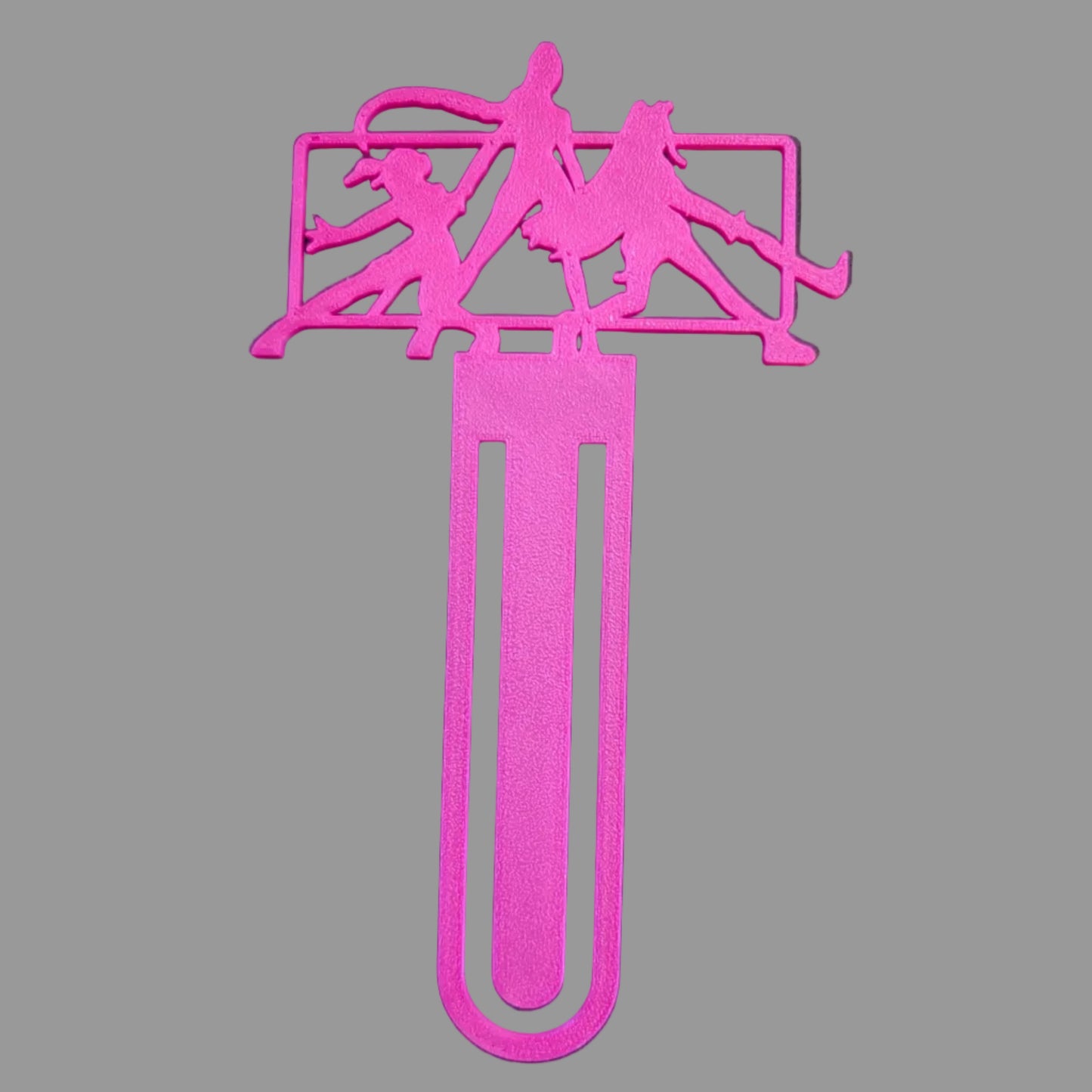 Pink bookmark with silhouette designs on a black background