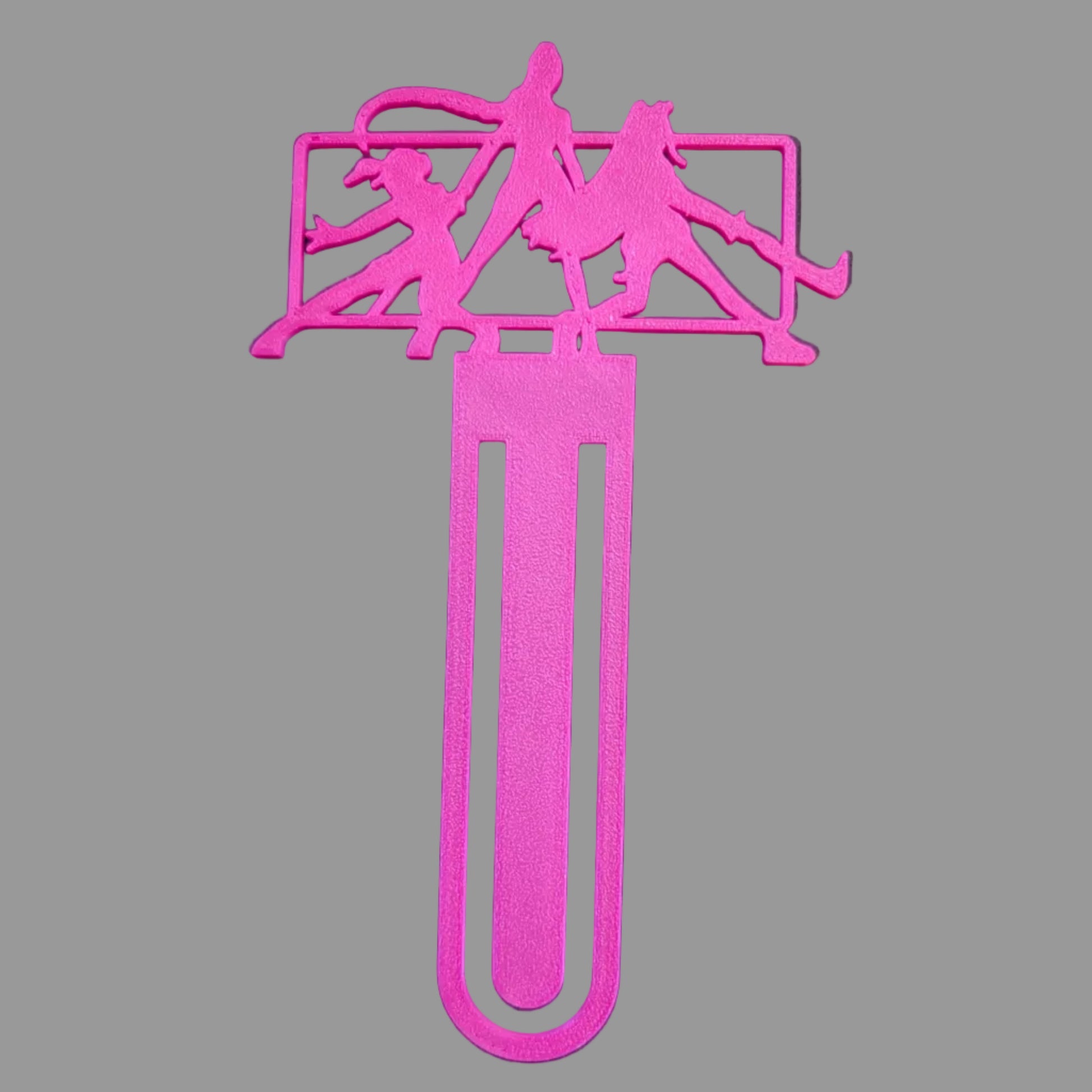 Pink bookmark with silhouette designs on a black background